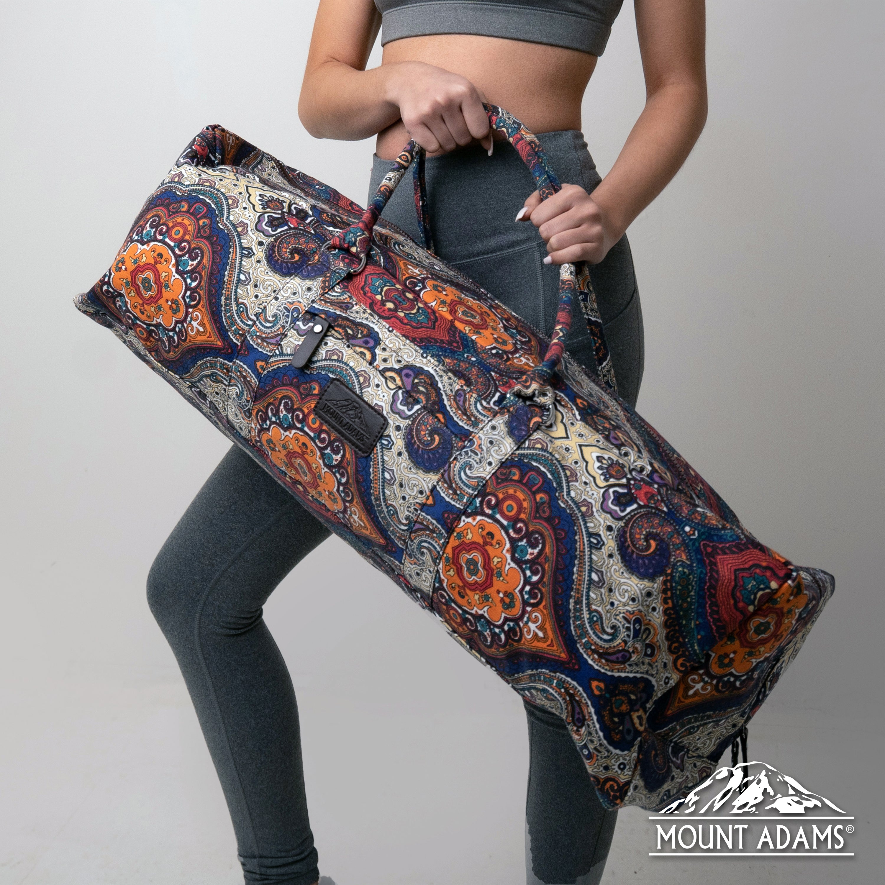 girl holding jewel yoga mat duffle bag